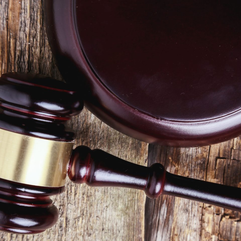 Judge hammer on the wooden table